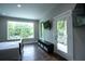 Bedroom featuring hardwood floors and a large window with access to the balcony at 1099 Vista Ne Trl, Atlanta, GA 30324