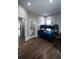 Bedroom featuring a bunk bed with hardwood floors, with a bathroom adjacent to the room at 1099 Vista Ne Trl, Atlanta, GA 30324