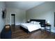 Spacious bedroom with wood floors, a walk-in closet, and a view of the outdoors at 1099 Vista Ne Trl, Atlanta, GA 30324