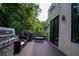 Spacious outdoor deck with a grilling area and comfortable seating, ideal for entertaining guests at 1099 Vista Ne Trl, Atlanta, GA 30324