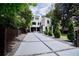 Landscaped property featuring a modern two-story home and concrete driveway at 1099 Vista Ne Trl, Atlanta, GA 30324