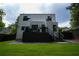 The back of the two-story home has an outdoor deck, a yard and a gravel area at 1099 Vista Ne Trl, Atlanta, GA 30324