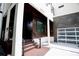 Stylish home entrance featuring wood accents, modern railings, and a glass garage door at 1099 Vista Ne Trl, Atlanta, GA 30324