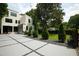 Striking modern home with a unique driveway and meticulously manicured landscaping at 1099 Vista Ne Trl, Atlanta, GA 30324