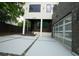 Two-story modern home with sleek lines, glass garage door, and a spacious driveway at 1099 Vista Ne Trl, Atlanta, GA 30324
