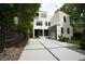Contemporary home with a large driveway, modern design elements, and well-maintained landscaping at 1099 Vista Ne Trl, Atlanta, GA 30324