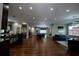 Expansive open concept living with dark hardwood floors, kitchen, pool table, and multiple sitting areas at 1099 Vista Ne Trl, Atlanta, GA 30324