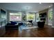 Cozy living room with large windows and modern decor featuring a decorative fireplace at 1099 Vista Ne Trl, Atlanta, GA 30324
