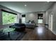 Spacious main bedroom featuring a sitting area, hardwood floors, and natural light from the large window at 1099 Vista Ne Trl, Atlanta, GA 30324