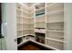 Walk-in pantry with custom shelving and storage for kitchen necessities at 1099 Vista Ne Trl, Atlanta, GA 30324