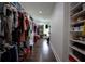 Large walk-in closet with custom shelving and ample storage space for clothing and accessories at 1099 Vista Ne Trl, Atlanta, GA 30324