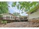 View of a backyard featuring a raised wooden deck attached to the rear of the home at 1652 Tryon Ne Rd, Atlanta, GA 30319