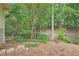 Private wooded backyard with mature trees, creating a serene and natural setting at 1652 Tryon Ne Rd, Atlanta, GA 30319