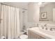 Classic bathroom with a shower-tub combination, white tile, and a modern vanity with stylish fixtures at 1652 Tryon Ne Rd, Atlanta, GA 30319