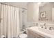 Clean bathroom with shower-tub combo, new sink, and simple decor at 1652 Tryon Ne Rd, Atlanta, GA 30319