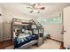 Bright bedroom featuring a bunk bed with creative stairs and window views at 1652 Tryon Ne Rd, Atlanta, GA 30319