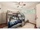 Bright bedroom featuring a bunk bed with creative stairs and window views at 1652 Tryon Ne Rd, Atlanta, GA 30319