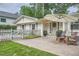 Inviting front entrance with stone patio, outdoor seating, and a charming front door with wreath at 1652 Tryon Ne Rd, Atlanta, GA 30319