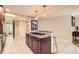 Open kitchen layout with a central island, granite countertops, and modern appliances for a chef-inspired experience at 1652 Tryon Ne Rd, Atlanta, GA 30319