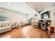 Cozy living room features hardwood floors, neutral paint, and plenty of natural light from the window at 1652 Tryon Ne Rd, Atlanta, GA 30319