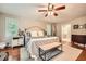 Bright main bedroom features hardwood floors, large windows, and a decorative ceiling fan at 1652 Tryon Ne Rd, Atlanta, GA 30319