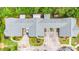 Birds eye view of a unique home featuring a gray roof, driveways, and colorful landscaping at 18 Mary Ne Ln, White, GA 30184