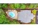 Overhead aerial shot of the home and kidney-shaped pool with sundeck and lounge chairs at 18 Mary Ne Ln, White, GA 30184