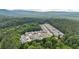 Stunning aerial view of a residential community nestled amidst lush greenery and rolling hillsides at 18 Mary Ne Ln, White, GA 30184