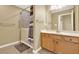 Accessible bathroom featuring a walk-in tub and a vanity with light wood cabinets at 18 Mary Ne Ln, White, GA 30184