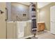 Bathroom featuring walk-in tub with patterned shower curtain and tile surround at 18 Mary Ne Ln, White, GA 30184