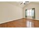 Bedroom with hardwood floors, ceiling fan, vaulted ceiling, and plantation shutters at 18 Mary Ne Ln, White, GA 30184
