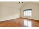 Bedroom with hardwood floors, vaulted ceiling, ceiling fan, and window with white blinds at 18 Mary Ne Ln, White, GA 30184