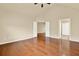 Bedroom showcasing hardwood floors, neutral walls, and double doors leading to another room at 18 Mary Ne Ln, White, GA 30184