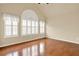 Serene bedroom featuring hardwood floors and large windows with shutters providing ample natural light at 18 Mary Ne Ln, White, GA 30184