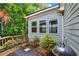 Rear exterior of the home with access to the deck and serene backyard at 18 Mary Ne Ln, White, GA 30184