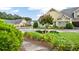Beautifully landscaped exterior view with lush green bushes and yellow flowers on a sunny day at 18 Mary Ne Ln, White, GA 30184