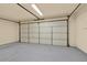 Spacious garage featuring a large door and a freshly painted floor at 18 Mary Ne Ln, White, GA 30184