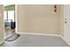 Spacious garage with painted floor and access door to green sunroom with natural light at 18 Mary Ne Ln, White, GA 30184