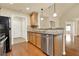 Contemporary kitchen featuring stainless steel dishwasher, granite countertops, and breakfast bar at 18 Mary Ne Ln, White, GA 30184