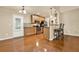 Bright kitchen featuring stainless steel appliances, granite countertops and beautiful wood flooring at 18 Mary Ne Ln, White, GA 30184