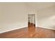 Open living room featuring hardwood flooring, vaulted ceilings, and seamless transition to other rooms at 18 Mary Ne Ln, White, GA 30184