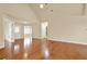 Well-lit living room featuring hardwood floors and vaulted ceilings, providing ample open space at 18 Mary Ne Ln, White, GA 30184