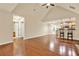 Expansive living area featuring hardwood floors, vaulted ceilings, a kitchen view and plenty of natural light at 18 Mary Ne Ln, White, GA 30184