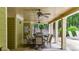 Covered outdoor seating area with ceiling fans, perfect for dining and relaxation by the pool at 18 Mary Ne Ln, White, GA 30184