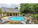 Relaxing community pool area with ample seating and nearby clubhouse at 18 Mary Ne Ln, White, GA 30184