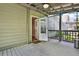 Covered, screened deck with entry door and views of the wooded yard at 18 Mary Ne Ln, White, GA 30184