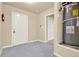 Functional utility room with water heater, door to the garage, and door to the house at 18 Mary Ne Ln, White, GA 30184