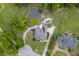 Expansive property with a charming home, lush landscaping, a pool, and a serene pond with a fountain feature at 2623 Lindsey Grace Ln, Buford, GA 30519