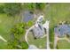 Expansive property with a charming home, lush landscaping, a pool, and a serene pond with a fountain feature at 2623 Lindsey Grace Ln, Buford, GA 30519