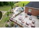 Inviting back deck overlooking a beautiful pool, pond, and backyard area with lush landscaping and mature trees at 2623 Lindsey Grace Ln, Buford, GA 30519